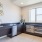 kitchen area with a sink and window