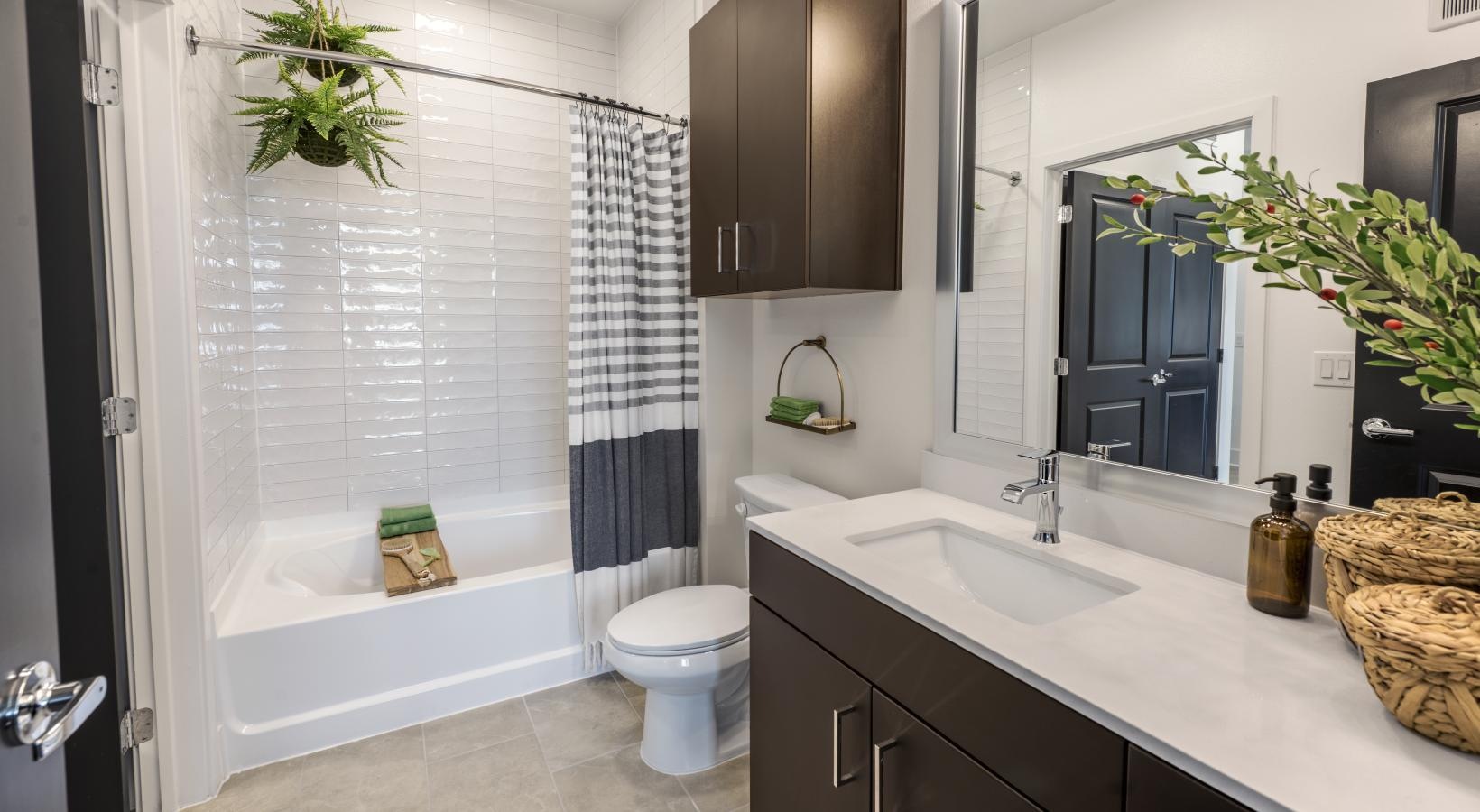 Bathroom options with thoughtful details a bathroom with a tub sink and toilet