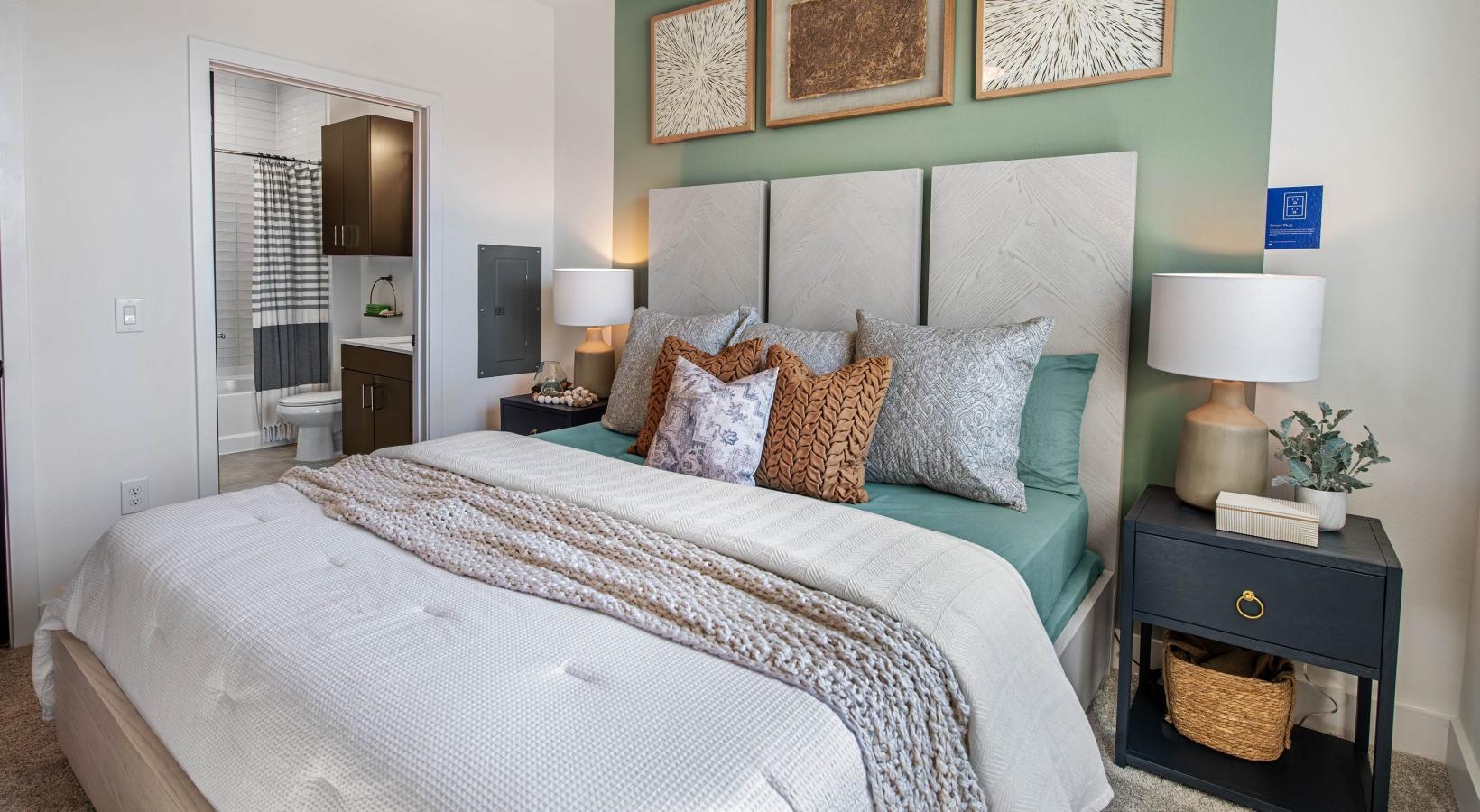 Relax and recharge in beautiful and spacious bedrooms a bed with a white bed spread